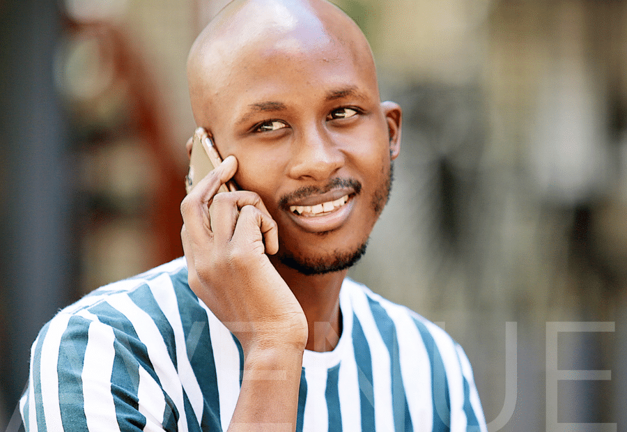 young african man on cell phone-corporate photography-avenue films